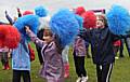 Guides take part in some cheerleading at the centenary event in Heaton Park.