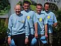 Eddie Holden of the Rochdale Support group of Marie Curie cancer alongside triathletes Michael Nelson, Liam Mulderrig and Adrian Woodrup.