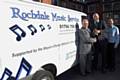 Councillor Keith Swift, Richard Charles and Cliff Woodworth from Rochdale Music Service receive the keys to the new music service van