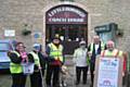 Bobby Moncaster, with spectacle collecting bucket. Pat Mullen, being escorted by Steve Lister and retired guide dog, Magnus. Norah Hawksworth, being escorted by Jamie Rome. Wearing the sandwich boards is Harry Hawksworth
