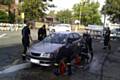 Fire fighters in Rochdale cleaning a car at the charity car wash