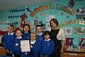 Ryan Thompson, Cloe Wainwright, Oliver Stokes, Ellie Warren, Lauren Mercer and Samueal Catlow show of their award certificate with thier teacher Kathryn Alker