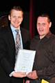 Andrew Payne (right) receiving an award from Skills 4 U in the summer