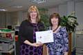 Dr Julie Higgins Chief Executive presents Catherine Scott with her award 