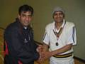 Tayyab receives his man of the match award from M Siddique, league organiser.