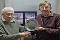 Harry Muncaster, President of Rochdale Photographic Society (left), awards Mike Davis the President's Competition Plate for his winning photos