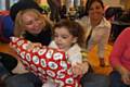 Xela Mills plays pass the parcel with her mum Claire Mills and Grandma Dawn Smith