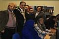 Syed Mashuk Miah,the Mayor of Rochdale, Shaukat Ali- Vice Chairman of WCCA and Hellal Choudhury- Chairman of WCCA and Councillor Farooq Ahmed over looking a couple ladies having a go on the computers