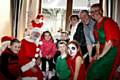 Santa, helpers and Springhill Hopsice Fundraising Manager, Ian Jenkins, surrounded by youngsters 