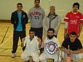 Idara Allstars celebrate their tournament win with Councillor Sharif.