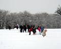 Children play in the snow at Healey Primary School