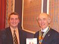 Dennis Skelton receives a cheque from President Elvet Smith of the Rotary Club.