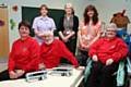 Members of the Rochdale Lions, (seated from left to right) Eileen Taylor, Peter Spencer and Linda Spencer, take a seat on a glideaway bed with syringe pumps, joined by (standing from left to right) Andrea Scholey, Yvonne Tunstall and Louise Gallagher from Rochdale Infirmary’s Children’s Unit