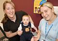 Community Children's Nurses, Jo Mark (L) and Lisa Bancroft with baby Ben Neilson