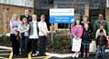 Staff and visitors outside the Croft Shifa Health Centre on Belfield Road