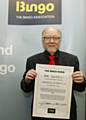 Jim Dobbin MP with his signed 'bingo bond'