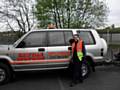 Imogene next to a Saville Motors vehicle