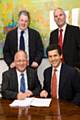 The council sign the contract with Sir Robert McAlpine. (Front: Rochdale Borough Council Chief Executive Roger Ellis, Mr Richard McAlpine. Back: Councillor Dale Mulgrew, Paul Walker, Project Manager.)

 
