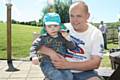 Graham Whiteside sat in the sun with his son Ky