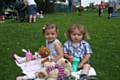 Young visitors and their teddy bears enjoying their picnic