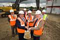 (Front, left to right) John Hudson, Chief Executive of Rochdale Development Agency, Garry Plumpton, Warehousing and Distribution Director at JD Sports, and Councillor Dale Mulgrew, Cabinet member for Development at Rochdale Borough Council cut the first sod of land at the new JD Sports development. (Back, left to right) Dave Perkins, Director of Programme at the NWDA, Robert Grafton, Development Director at Wilson Bowden and Jason Bright, Project Manager for Winvic