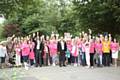 The ladies dressed in pink get ready to set off on their charity walk