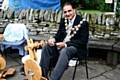 The Mayor of Rochdale, Councillor Zulfiqar Ali having a go at wool spinning