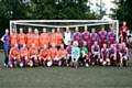 The players surround Clair Booth (centre) before kick off