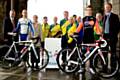 Cyclists Steven Burke (front left) and Richard Handley (front right) with organisers and local cyclists help to launch Stage One of the Tour of Britain at the town hall