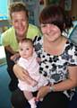 Lauren Sutton from Rochdale with baby daughter, Amelia, and Community Nursery Nurse, Julie Pickles