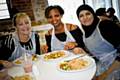 Maggie Howlett, Bella Katusima and Aiysha Rameem enjoying the food they made at the class