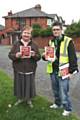 Heywood resident Jean Gray is handed a Foul Play red card from Natalie Williams (working on behalf of the council)