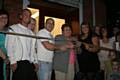 Ian Foran and his Grandmother cut the ribbon to officially open TLF Fitness in the presence of staff friends and family