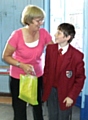 Mrs Mills receives a present from Aston Buckley - a former pupil of Glebe House and currently attending Beech House