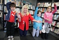 Guinness Northern Counties Housing Manager, Leila Poricka with Billy Corns, Mia Brooks, Kiera Carroll and the spooky mobiles they made.