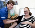 Midwife Catherine Cairns with a pregnant woman 