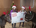 Angel, Karissa age 9, Martha age 7 and Peanut help launch the NSPCC's Letter from Santa 