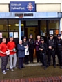 Kirkholt officers with Councillor Colclough, Fire Service volunteers and local resident Sheila Noakes outside the police post.
