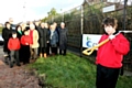 The turf cutting ceremony to commence the start of the new building<br/>Gabriel Reynolds (with the spade) Front row: Robert Dring, David Langley, Pupils at Darnhill PRU. Second row: Cheryl Eastwood, Executive Director Children’s Services, Councillor Donna Martin, Cabinet Member for Children, Schools and Families, Rosemary Jones, School Governor, Keith Hill, BSF Lead Rochdale Borough Council, Sheila Higginbottom School Business Manager, Brian Ashworth, School Governor