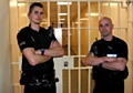 PCs Steven Raczkowski and Jason Aulton in front of the cells at Bury