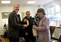 Dale Mulgrew pulling out the winning ticket alongside Margaret Jones from Health Aid UK and Kim Morrisey who was invited to be a witness to the draw