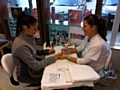 A customer enjoys a manicure at the new-look Co-operative Pharmacy in the Cutgate Shopping Centre. 
