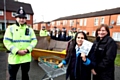 PC Brendan Walsh of Greater Manchester Police with Kingsway Park pupil Halima Akhtar (age 11) and Guinness Northern Counties Housing Officer, Lorraine Sykes.
Background: fellow Kingsway Park pupils and representatives from GMP

