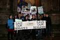 People gathered outside the Town Hall with placards