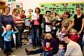 Parents and children at Derby Street Children’s Centre with a copy of their Outstanding Ofsted report