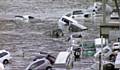 In this image from Japan’s NHK TV video footage, vehicles are washed away by the tsunami. Picture courtesy Press Association 