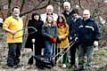 Community members alongside Councillors taking part in the Milnrow clean up