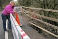 Councillor Ann Metcalfe at the barrier which has been errected on Ashworth Road