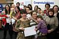 The peer support volunteers and their babies with Emmerdale star Zoe Henry, centre, at the celebration event