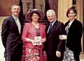 Shauna Dixon shows off her MBE with her family (from the left) son Matthew, husband Bryan and daughter Rachael